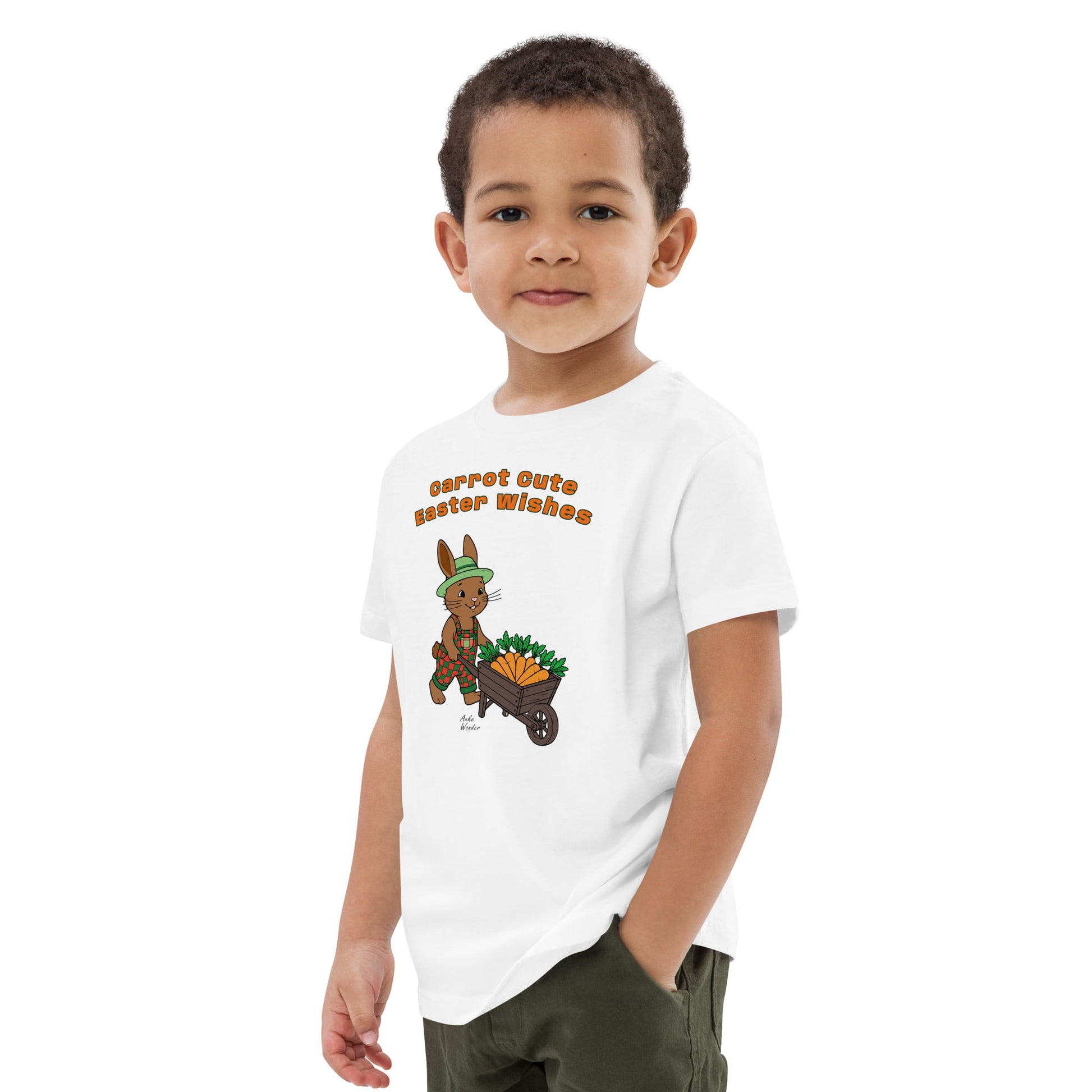 Child wearing a white t-shirt with a bunny and carrot design on a white background