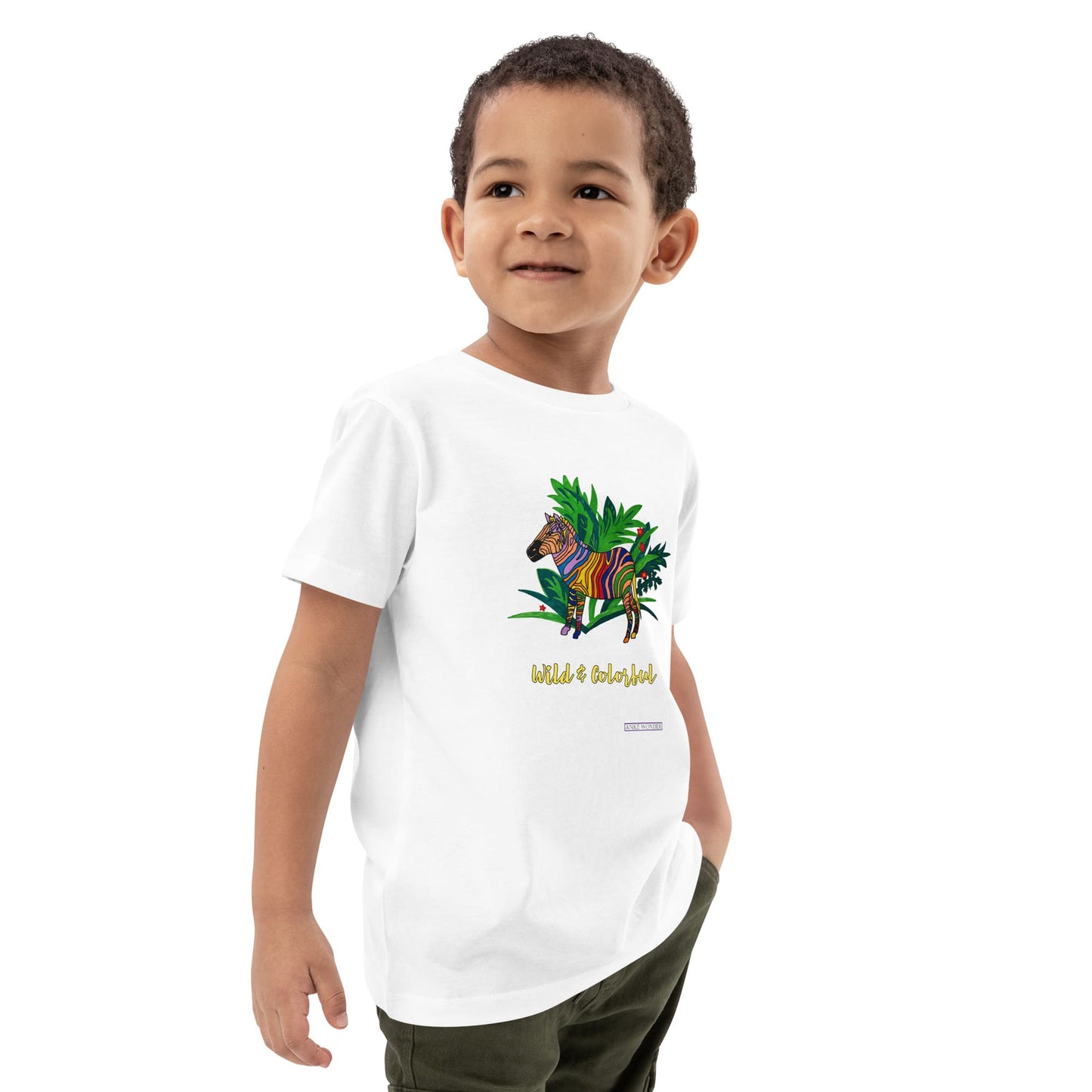 Boy wearing a white t-shirt with a colorful zebra design and text 'Wild & Colorful' on a white background