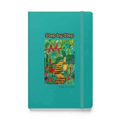 Teal notebook with a colorful illustration  of plants on the cover titled 'Step by Step' by Anke Wonder.
