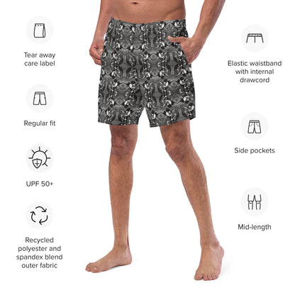 Close-up of the front-left view of men’s recycled swim trunks with a black and white mirrored bird pattern. Eco-friendly swimwear featuring elastic waistband and side pocket.