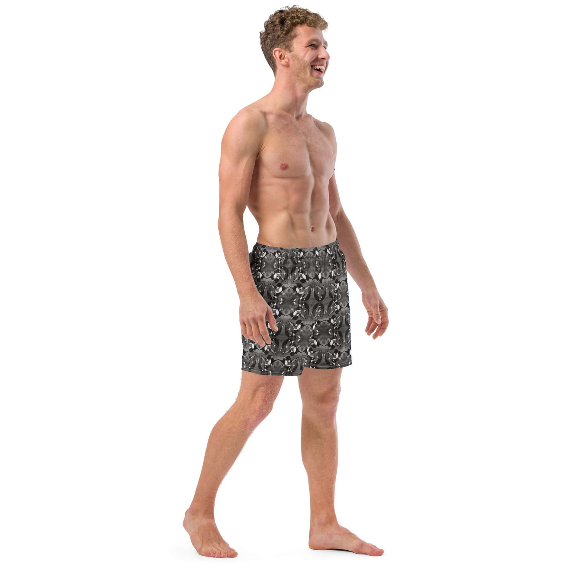 Right profile of eco-conscious men’s swim trunks with black and white bird print, highlighting fit, comfort, and artistic detail in the recycled material.