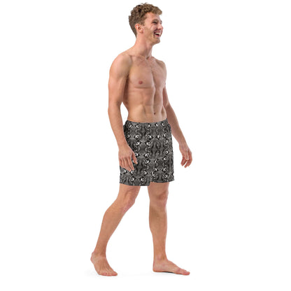 Right profile of eco-conscious men’s swim trunks with black and white bird print, highlighting fit, comfort, and artistic detail in the recycled material.