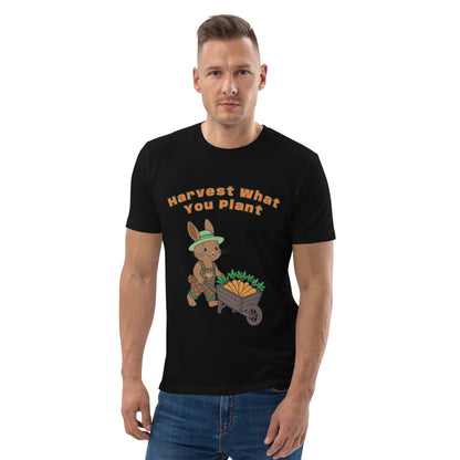 Man wearing a black t-shirt with a graphic of a rabbit and text 'Harvest What You Plant' on a white background