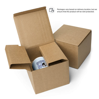 Packaging of white and blue ceramic mug with a rblue handle and red interior displaying the words "Guinea Pig Mom" and an illustrated black and white guinea pig.
