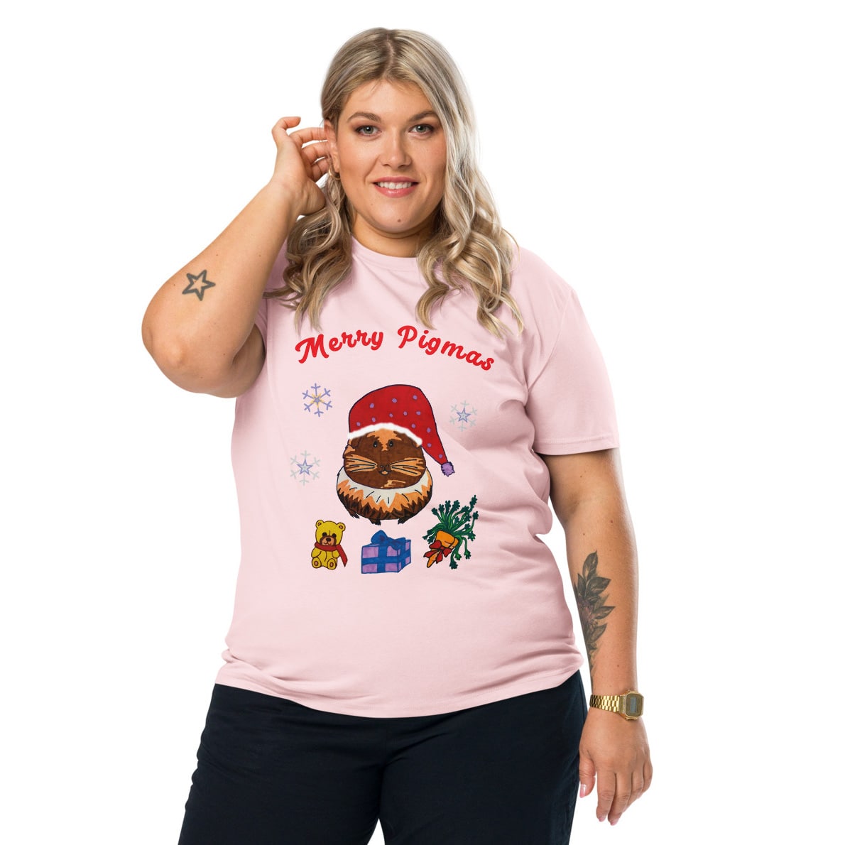 Woman wearing a pink t-shirt with Christmas-themed graphics and text 'Merry Pigmas' on a white background