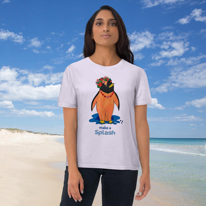 Woman wearing a t-shirt with a penguin design and the text 'Make a splash' on a beach