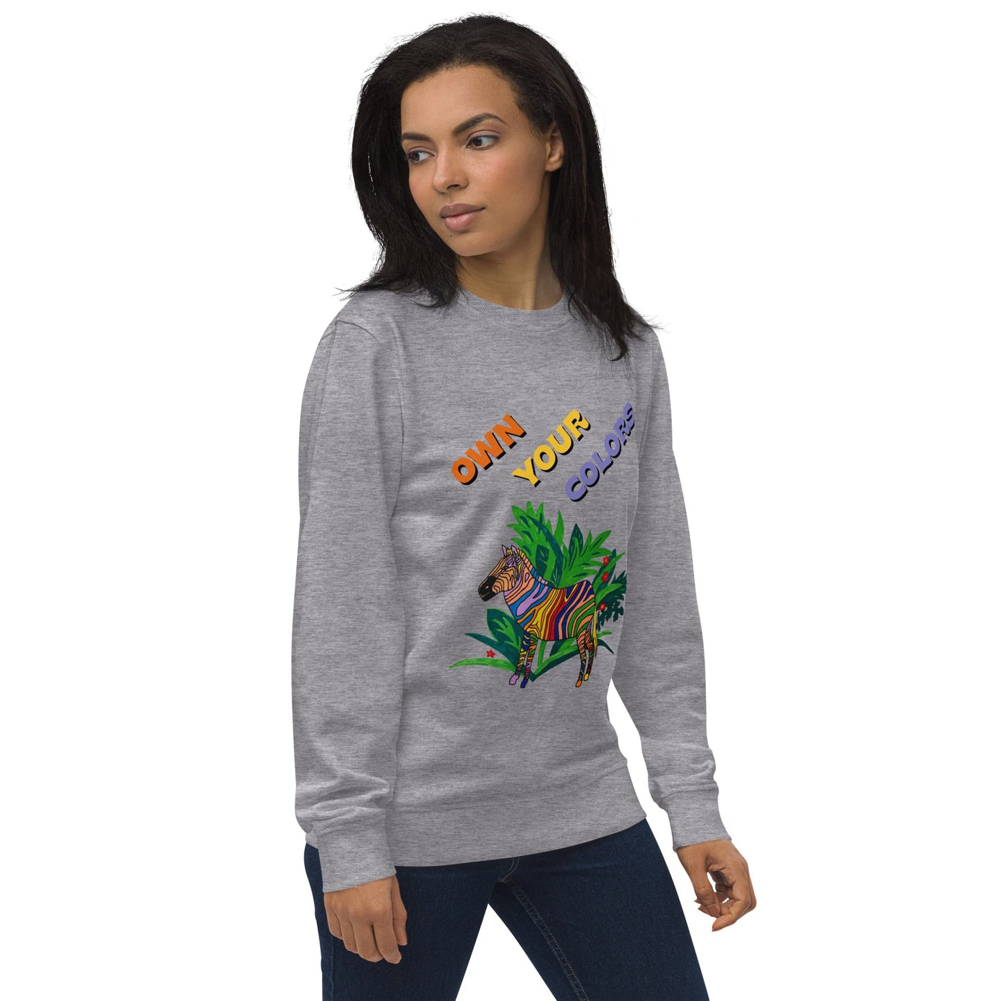 Woman wearing a gray sweatshirt with colorful zebra graphics and text on a white background