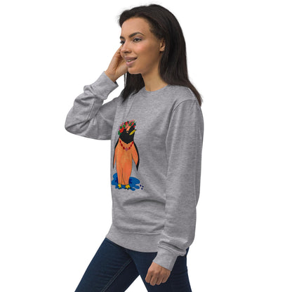Woman wearing a gray sweatshirt with a colorful penguin design on a white background, standing to the side.