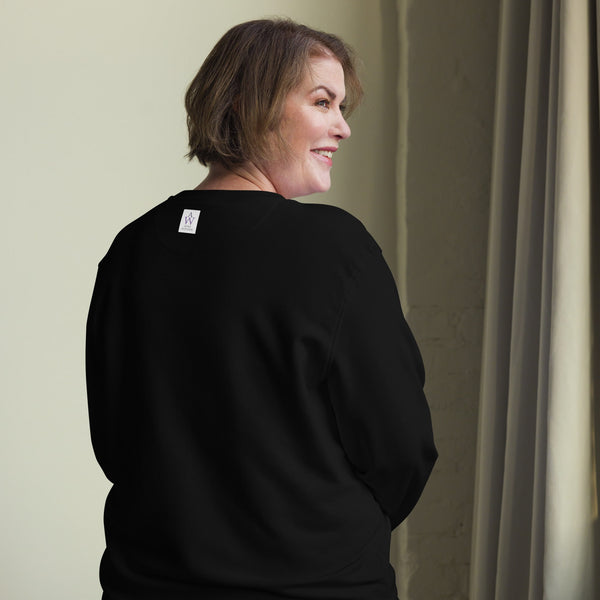 A plain black organic cotton sweatshirt with a smooth back, showcasing its sustainable material and comfortable fit and the Anke Wonder Label.