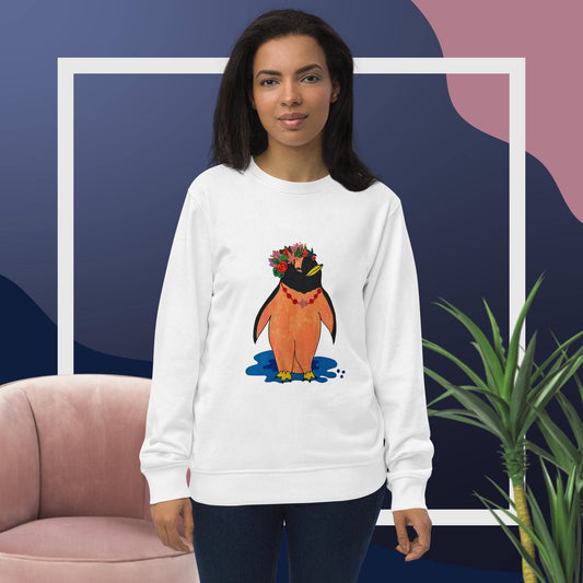 Woman wearing a white sweatshirt with a penguin design, standing against a colorful abstract background.