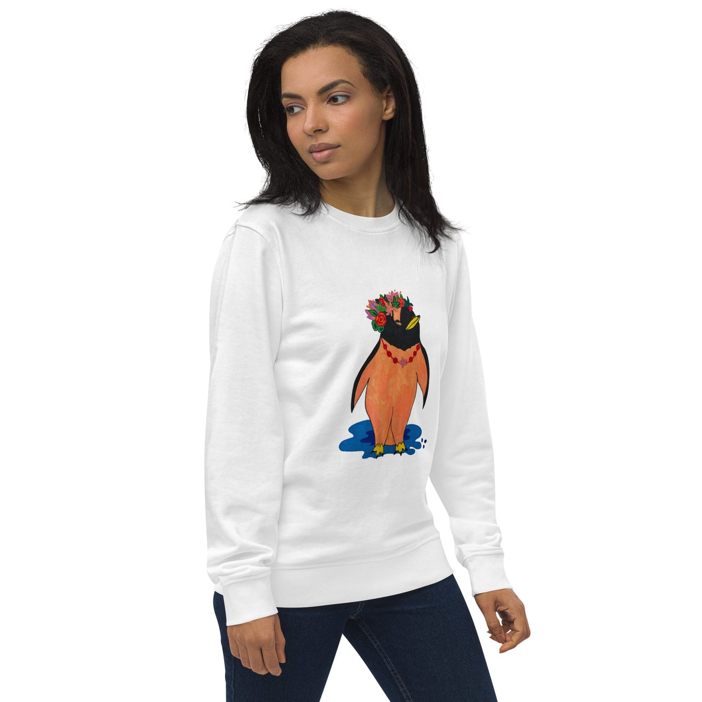 Woman standing to the side and wearing a white sweatshirt with a colorful penguin design on a white background