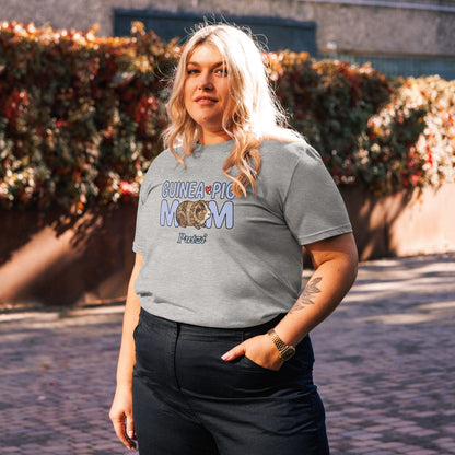 Person wearing a gray t-shirt with 'GUINEA PIG MOM' text, standing outdoors.