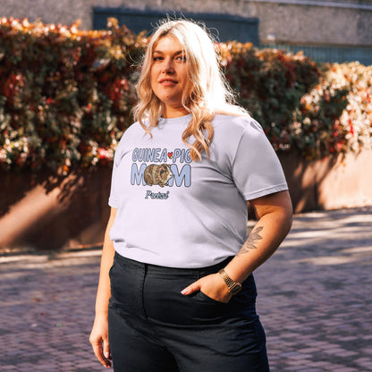 Person wearing a t-shirt with 'Guinea Pig Mom' text and graphic, standing outdoors.