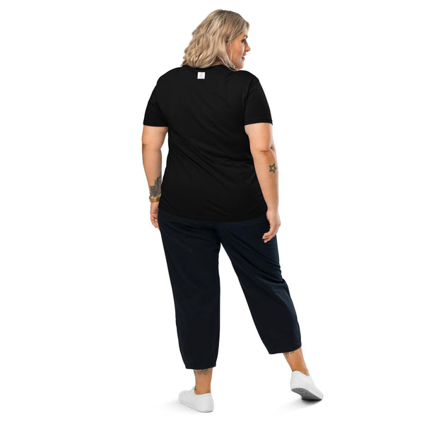 A woman displaying the back of a black organic cotton T-shirt, showcasing its classic and versatile design by Anke Wonder.