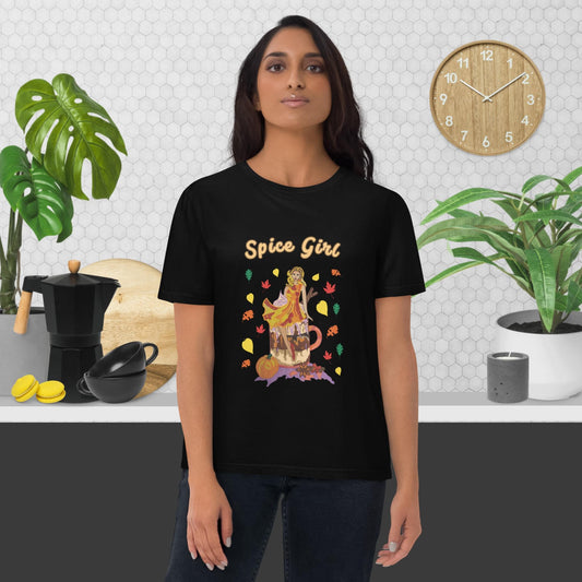 Woman wearing a black t-shirt with a colorful graphic design with pumpkin spice latte and the text 'Spice Girl' in a kitchen setting