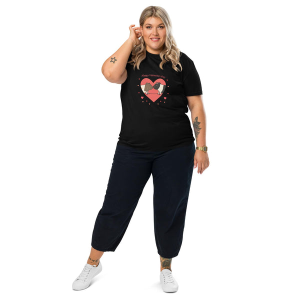 A woman wearing a black organic cotton Valentine's T-shirt featuring a guinea pig heart print, posing with a stylish and confident look.