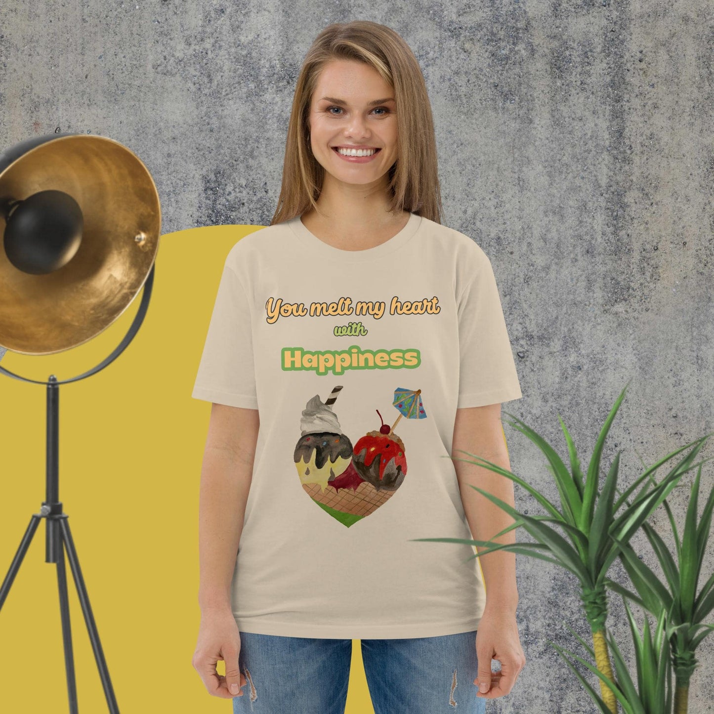 Woman wearing desert dust organic cotton t-shirt with colorful ice cream heart design and the phrase “You melt my heart with Happiness” by Anke Wonder.