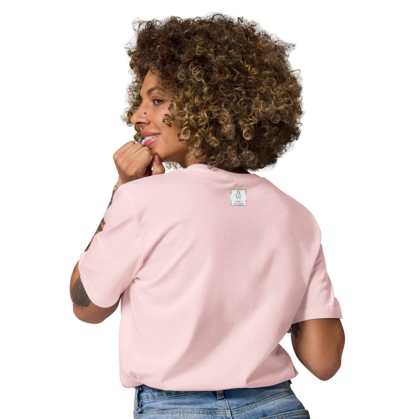 Back view of a women’s organic cotton t-shirt in pink showing minimalist clean finish, feminine fit and the Anke Wonder branding.