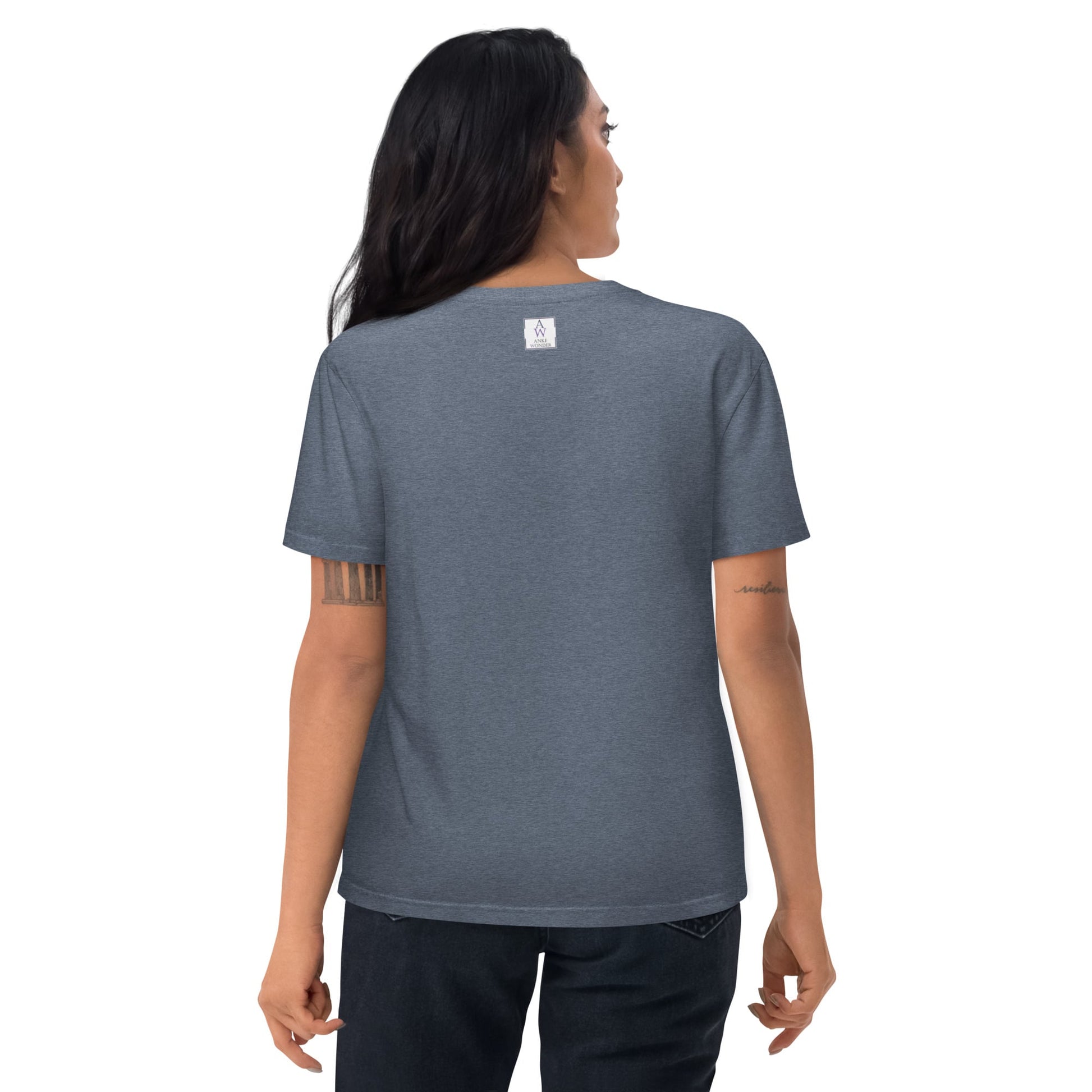 Woman showing the backside of the dark heather blue organic cotton t-shirt, highlighting the neck label and fit.