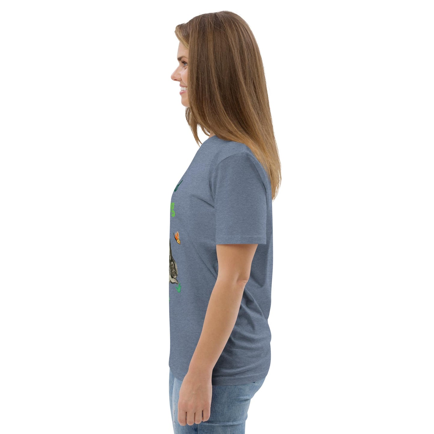 Woman in side view wearing "Ruhe & Erholung" rabbit design t-shirt in dark heather blue, showing the relaxed fit and short sleeves.