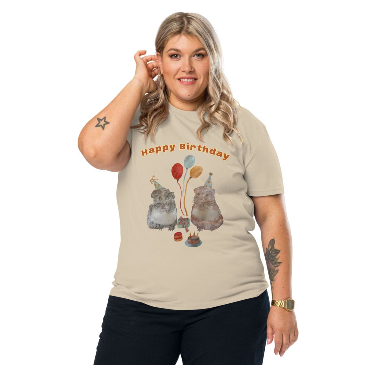 Woman wearing a beige t-shirt with 'Happy Birthday' and with guinea pig design on a white background