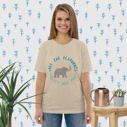 Woman wearing a desert dust eco tee with elephant graphic and “Save the Elephants” slogan; relaxed front view.