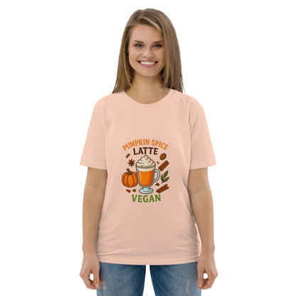 Woman wearing a peach t-shirt with a pumpkin spice latte graphic and vegan text.