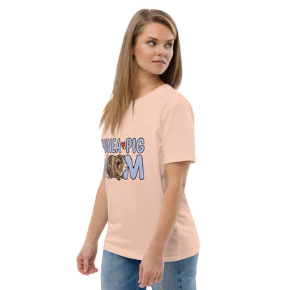 Woman wearing a peach t-shirt with 'Guinea Pig Mom' text and graphic on a white background