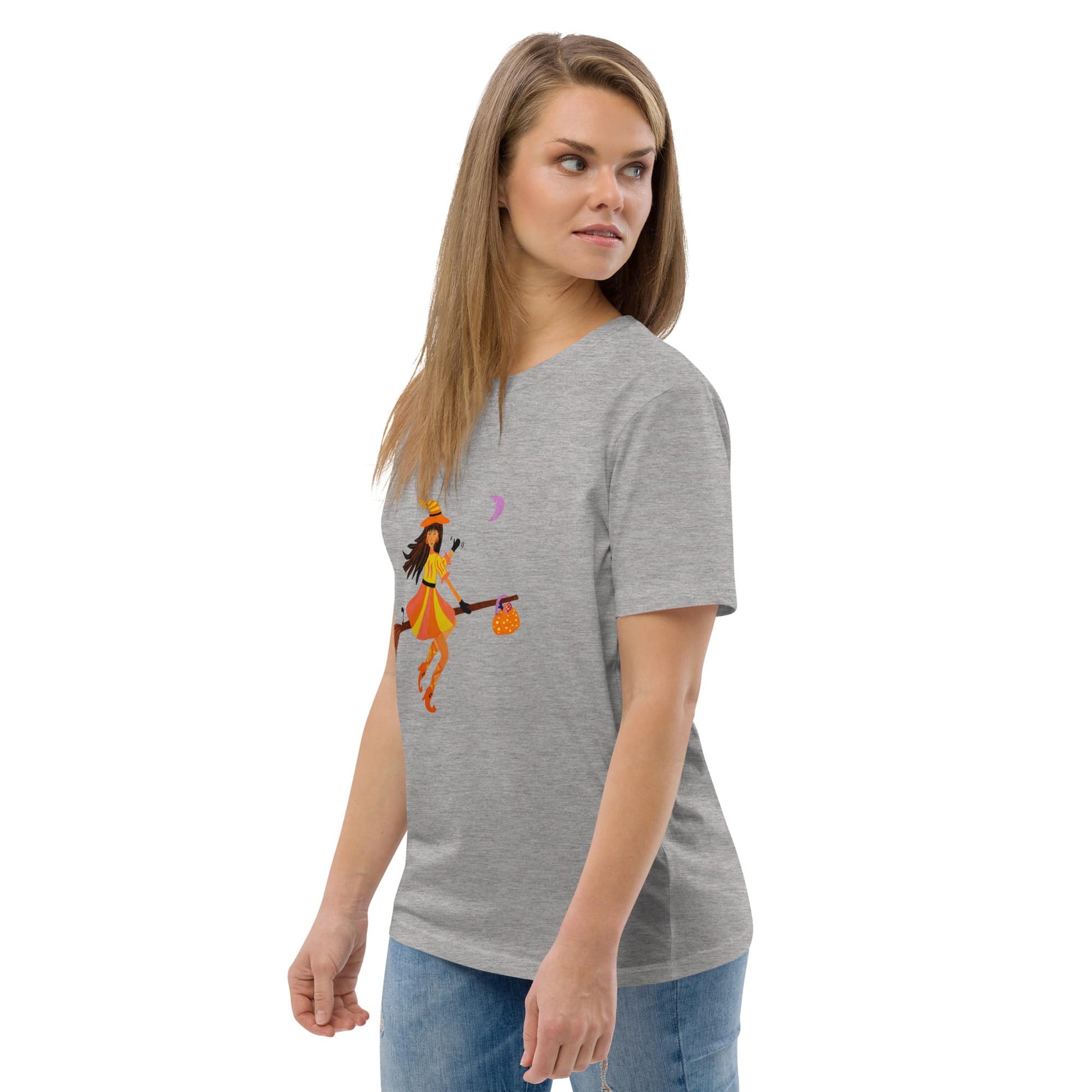 Woman wearing a gray t-shirt with a Halloween Witch design on a white background