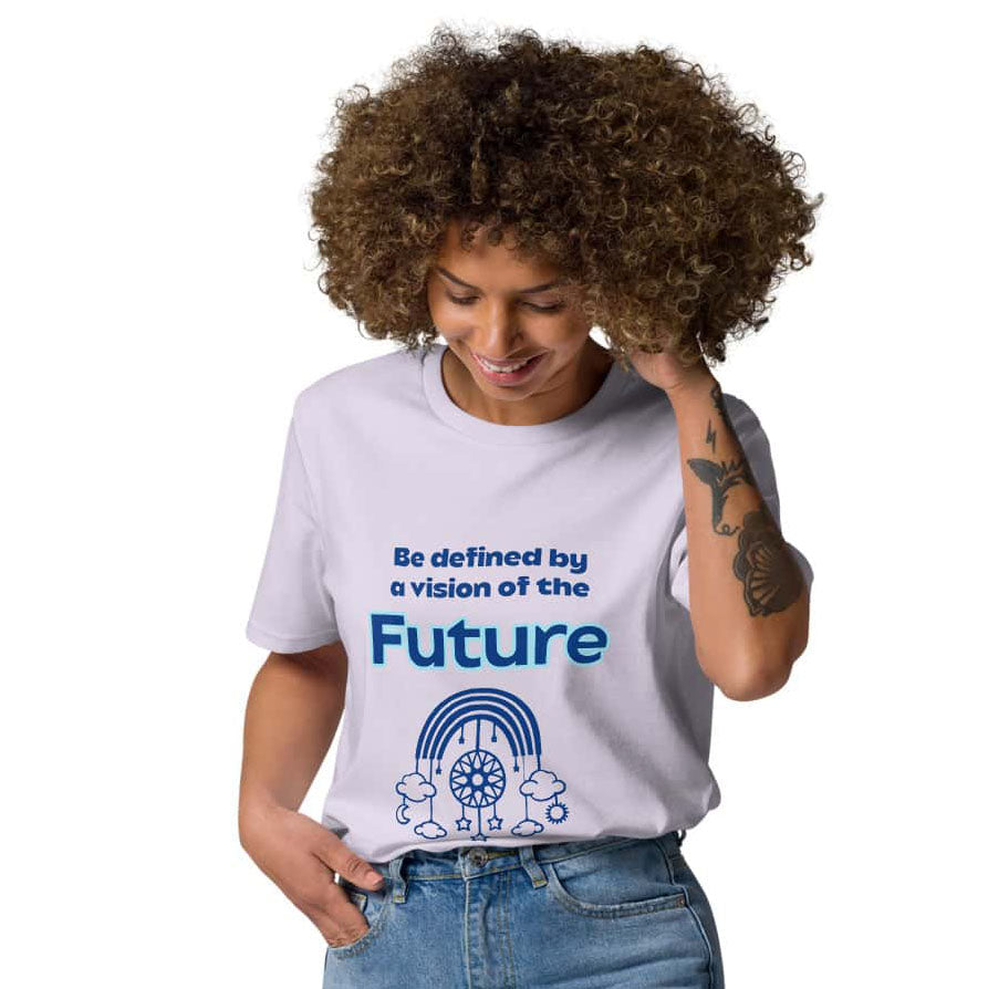 A Black woman wearing a lavender organic cotton t-shirt tucked into high-waisted blue jeans, standing confidently. The t-shirt features a light blue futuristic dream catcher design and inspiring quote 'Be definied by a vision of the future'.