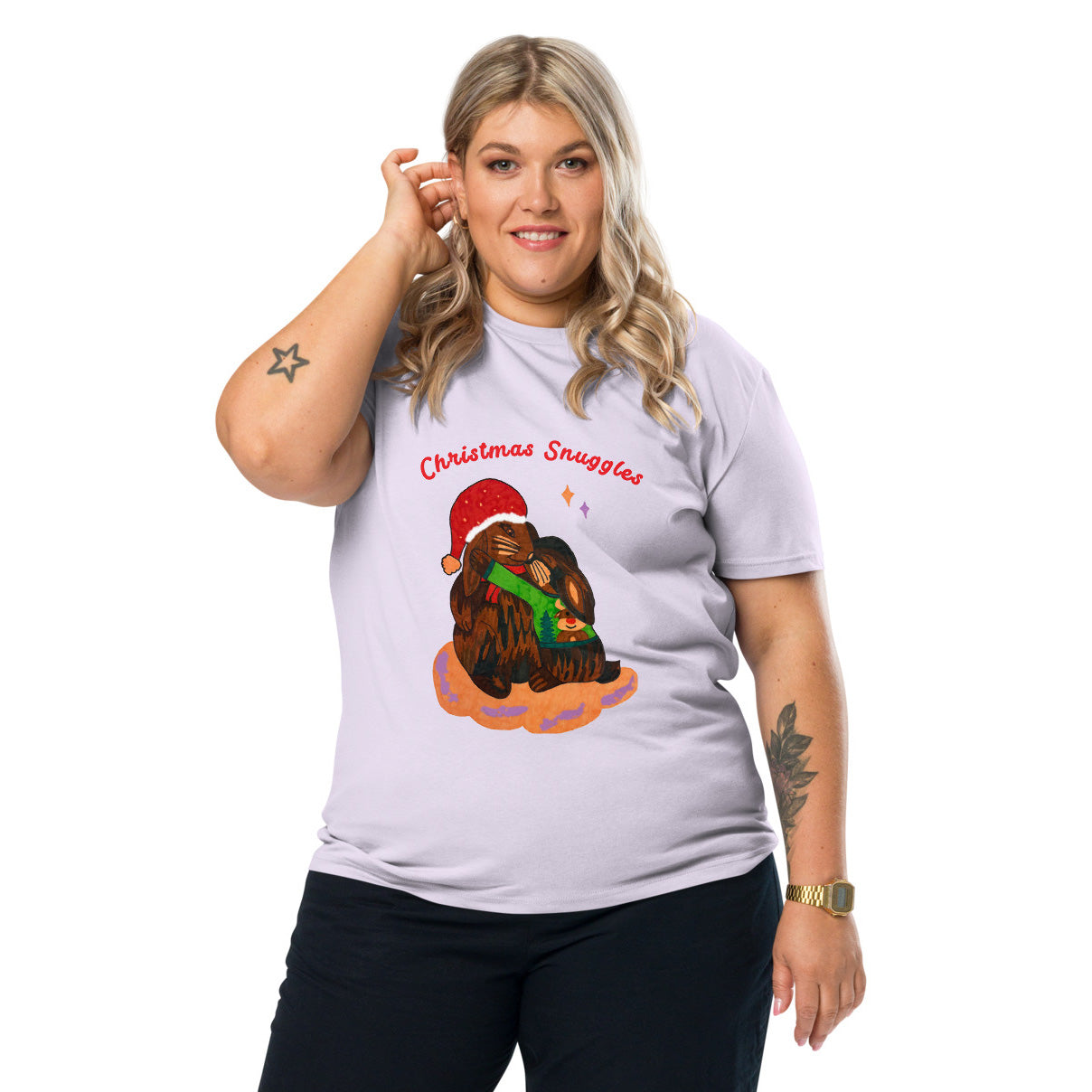 Woman wearing a lavender t-shirt with a Christmas-themed bunny graphic and text 'Christmas Snuggles'.