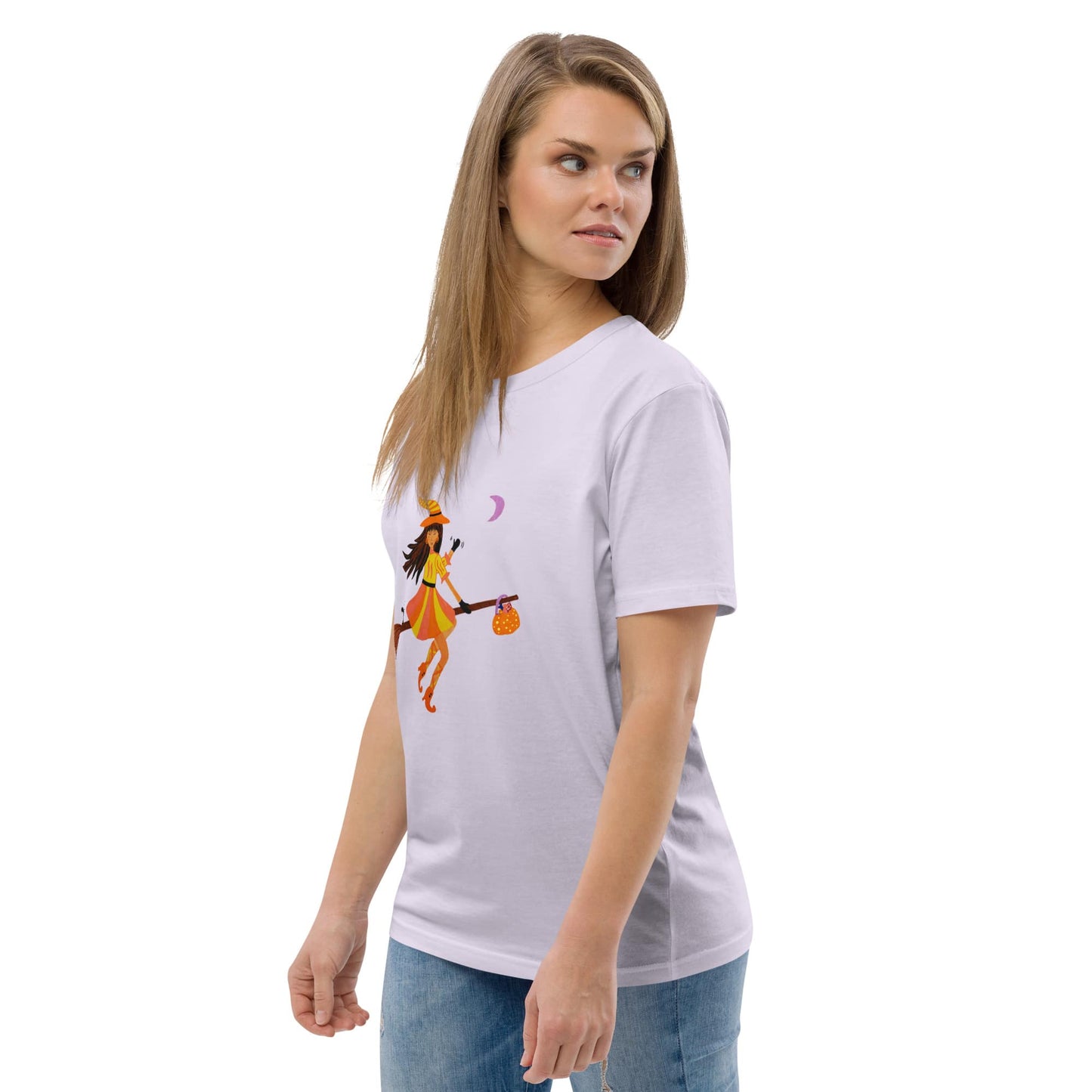 Woman wearing a lavender t-shirt with a halloween witch on broom design on a white background