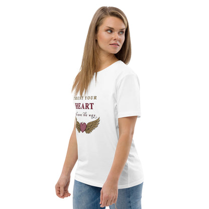Woman wearing a white t-shirt with a motivational quote on a plain background