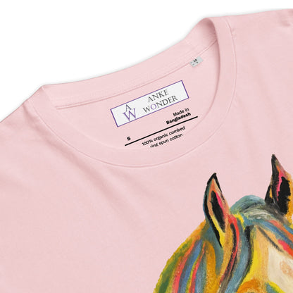 Close-up of a light pink t-shirt showing the inner neck label with 'ANKE WONDER' and a colorful painted horse design on the front.