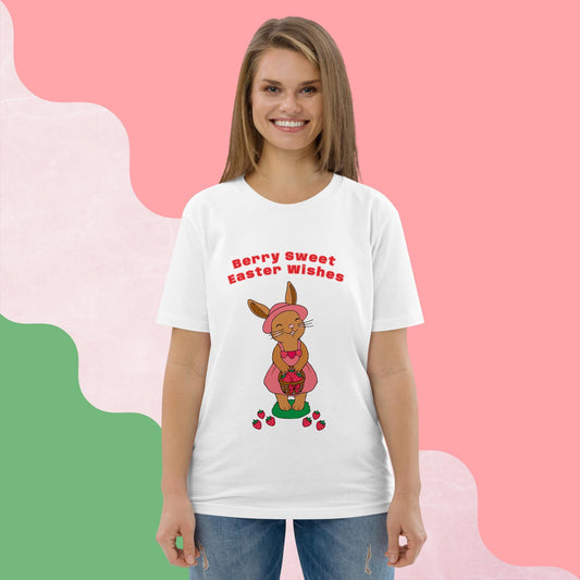 Woman wearing a white t-shirt with an Easter-themed bunny and strawberry design on a pink background