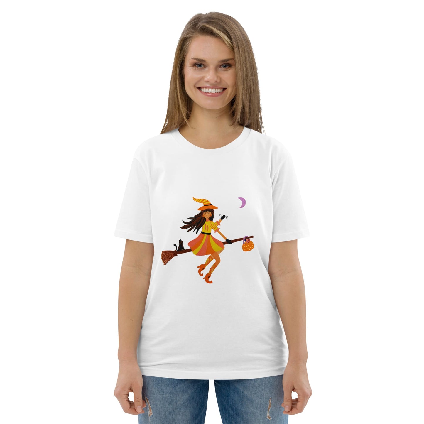 Woman wearing a white t-shirt with a witch graphic design on a white background