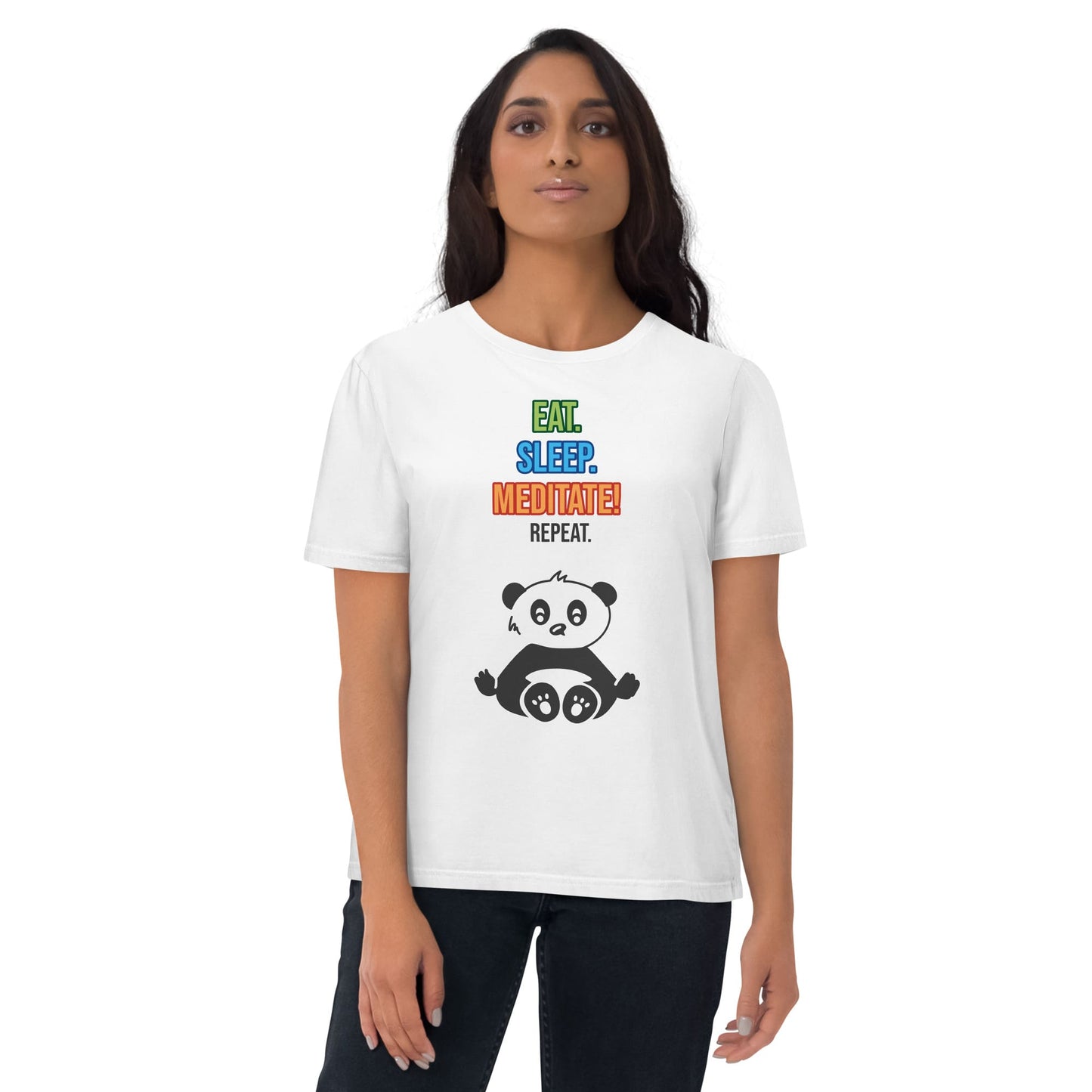 Woman wearing a white organic cotton that features a colorful "Eat. Sleep. Meditate! Repeat." text and a cute panda illustration by Anke Wonder.