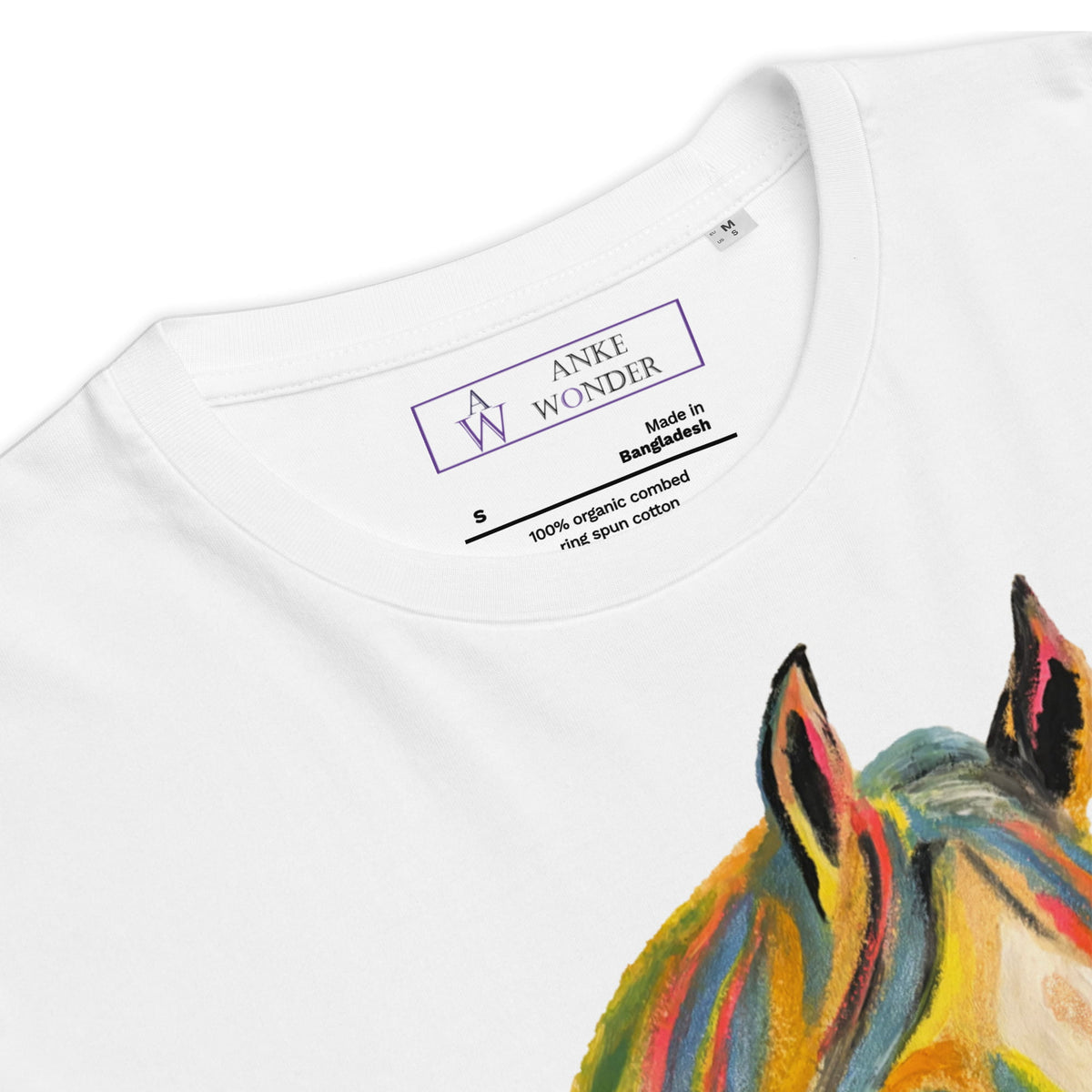 Close-up of a white crewneck t-shirt showing the inner neck label with 'ANKE WONDER' and a colorful painted horse graphic on the front.