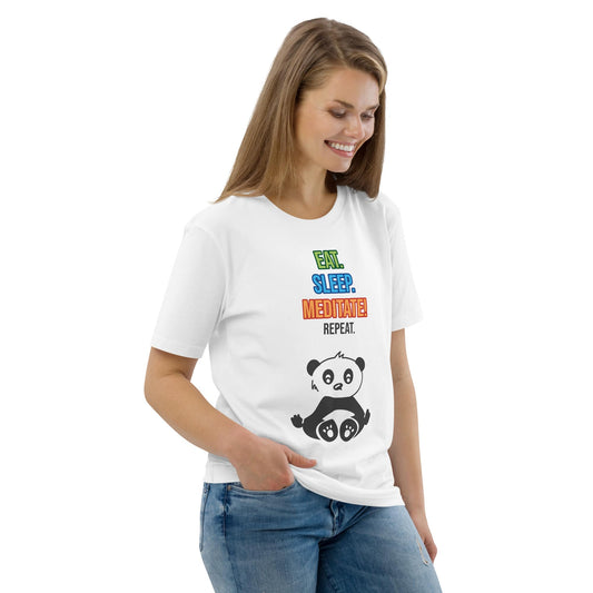 Woman wearing an organic cotton t-shirt in white, photographed from the front at a right angle. The shirt features a playful panda and the text “Eat. Sleep. Meditate! Repeat.” Her relaxed pose highlights the comfortable fit and the soft drape of the fabric.