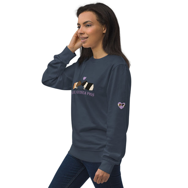 Model wearing a navy sweatshirt, highlighting the purple heart with guinea pig faces print on the sleeve.