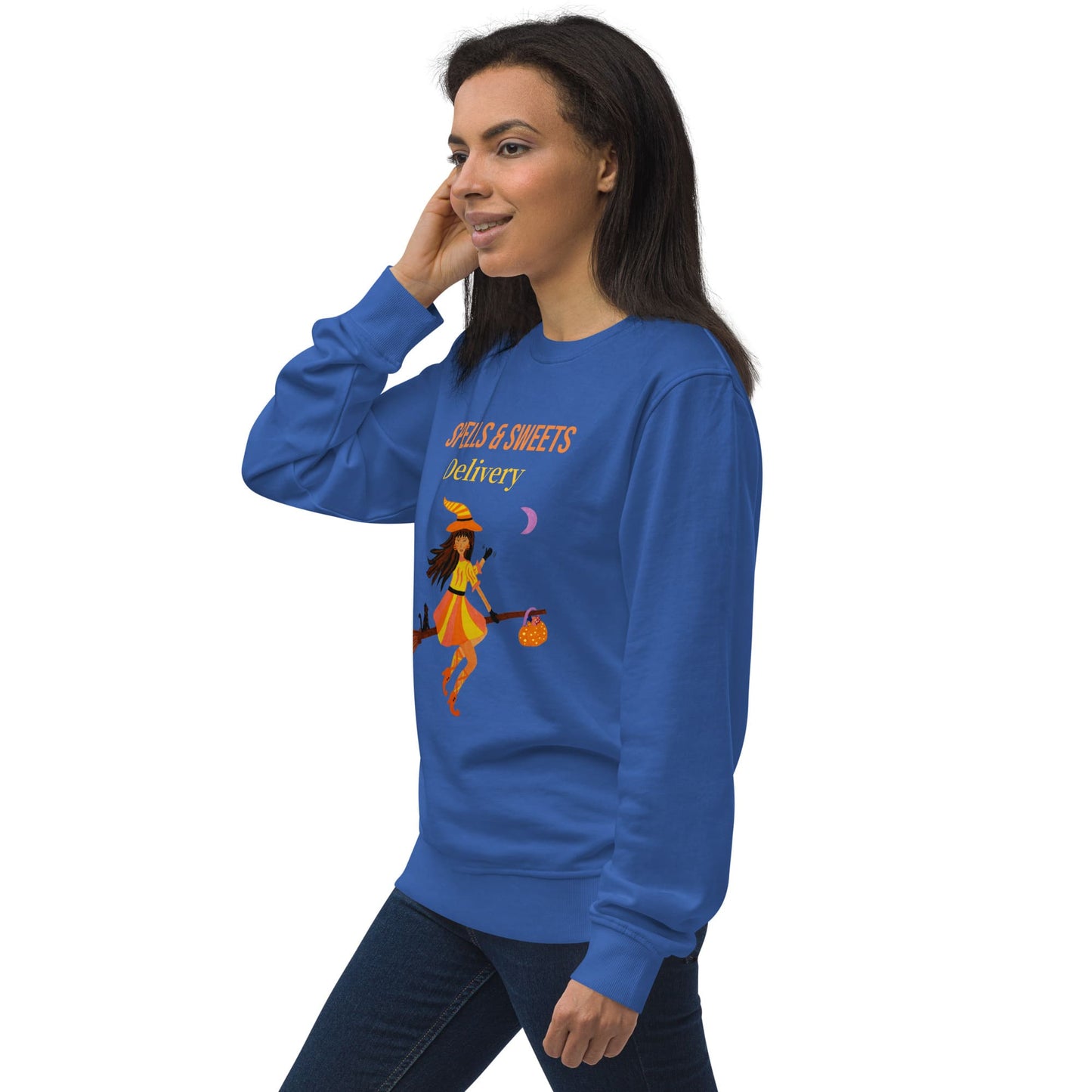 Woman wearing a blue sweatshirt with a Halloween Witch design on a white background