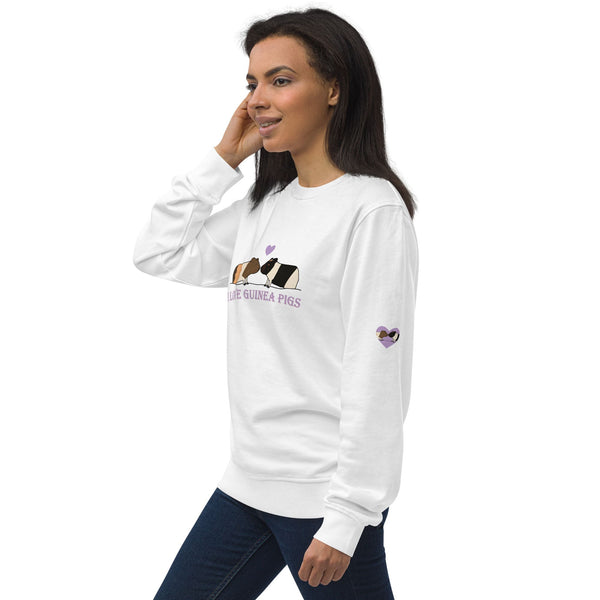 Model wearing a white sweatshirt, highlighting the purple heart with guinea pig faces print on the sleeve.