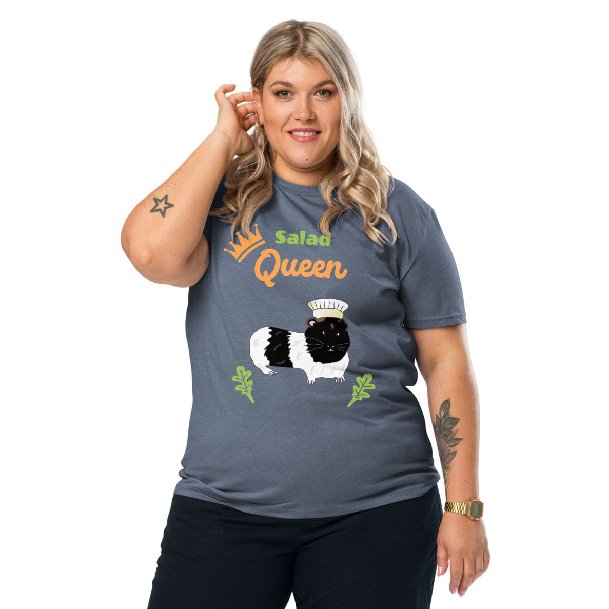 Plus-size woman wearing a organic cotton t-shirt in heather blue with “Salad Queen” design featuring a black-and-white guinea pig wearing a chef’s hat, surrounded by lettuce leaves.