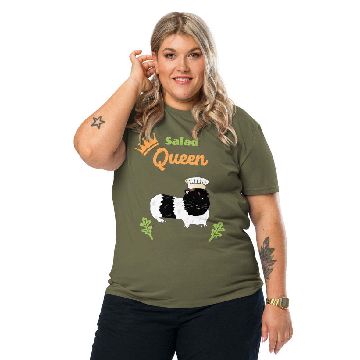 Plus-size woman wearing a organic cotton t-shirt in khaki with “Salad Queen” design featuring a black-and-white guinea pig wearing a chef’s hat, surrounded by lettuce leaves.