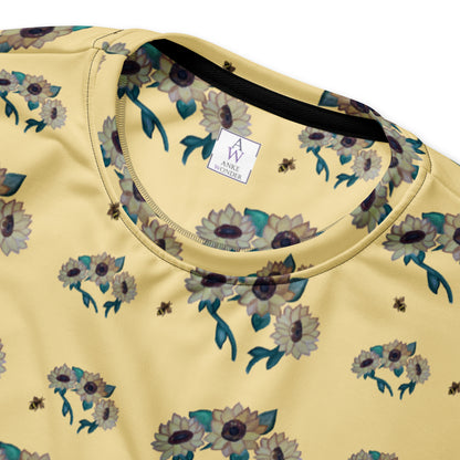 Yellow shirt with floral pattern and brand label Anke Wonder on a white background