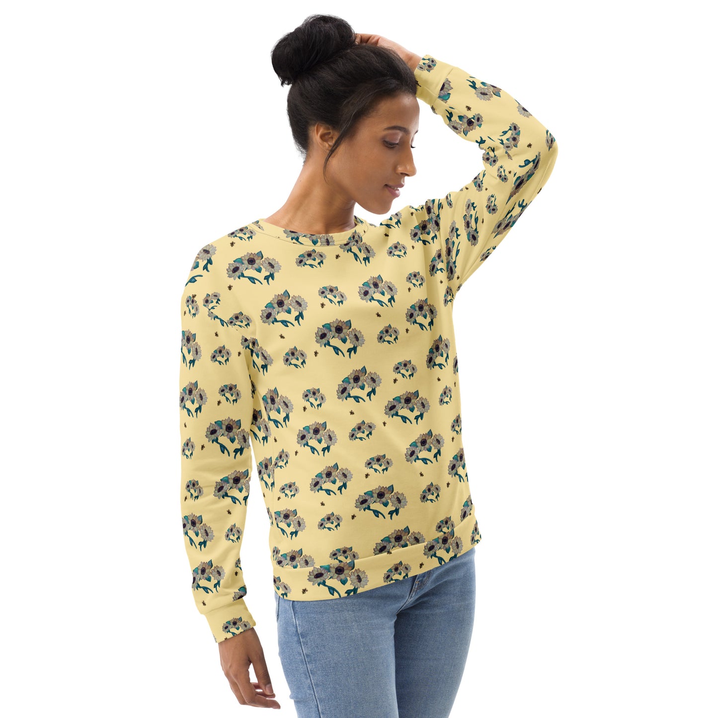 Woman wearing a yellow floral-patterned long-sleeve shirt on a white background