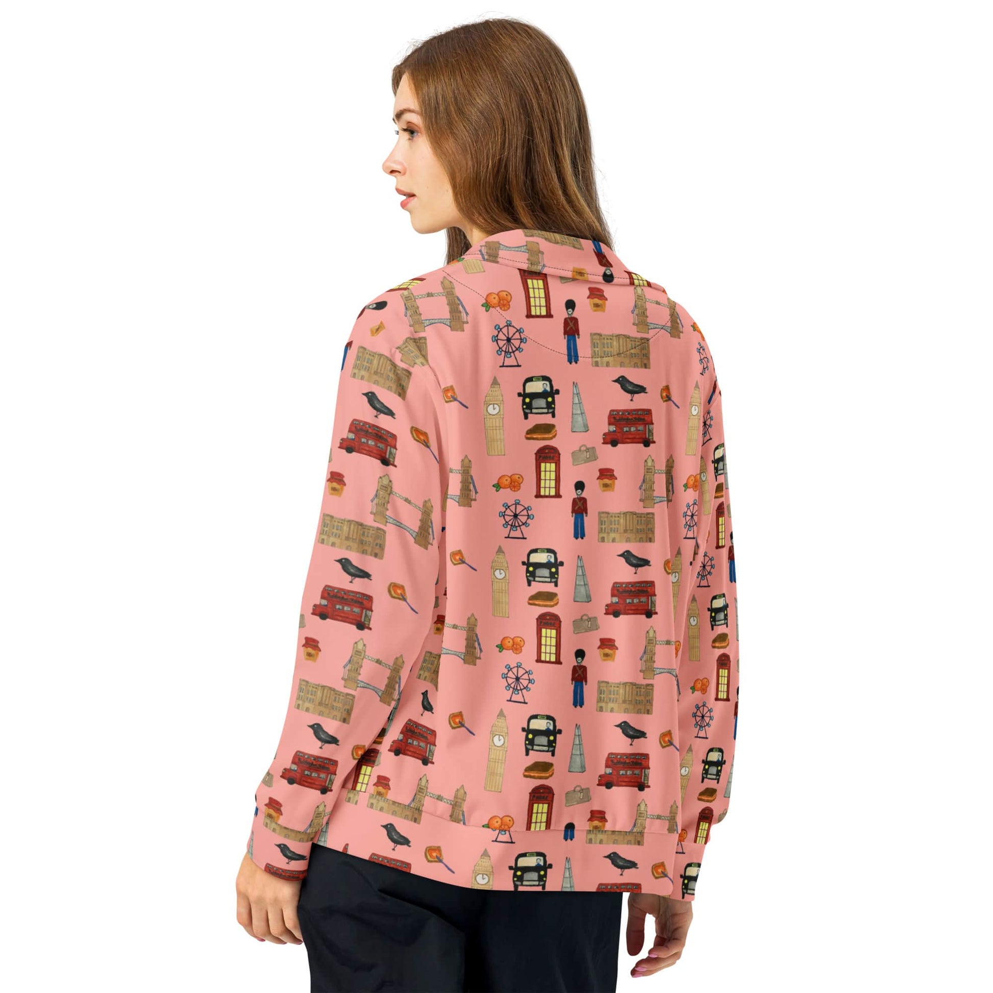 Back view of woman modeling Mona Lisa red eco track jacket with London icon prints on sleeves and shoulders, highlighting the sleek silhouette.