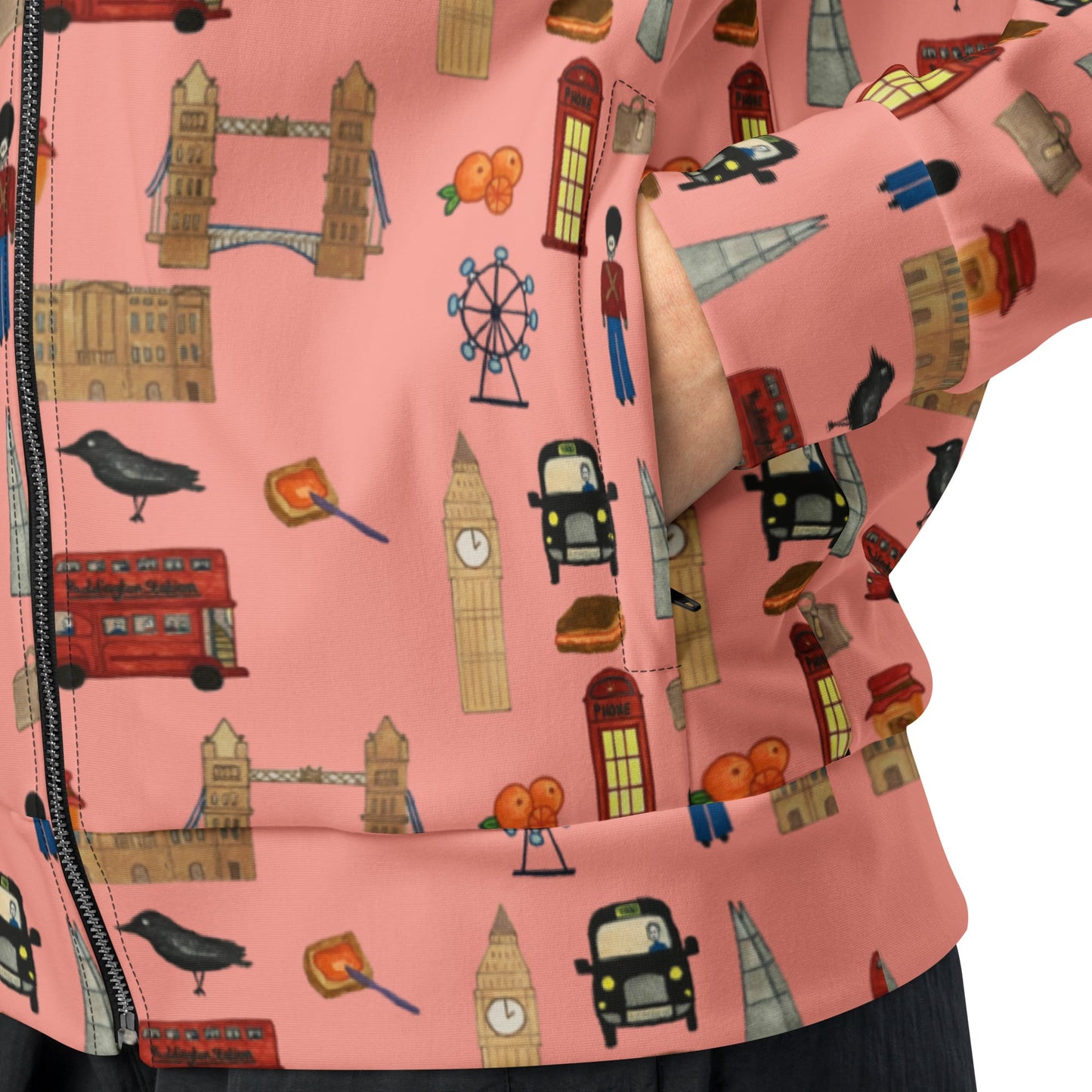 Zoomed-in detail of zippered side pocket on red women's track jacket, showing premium zipper and eco fabric texture.