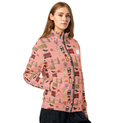 Front view of woman wearing vibrant red track jacket with London-themed illustrations, showcasing fit, color, and playful sleeve details.