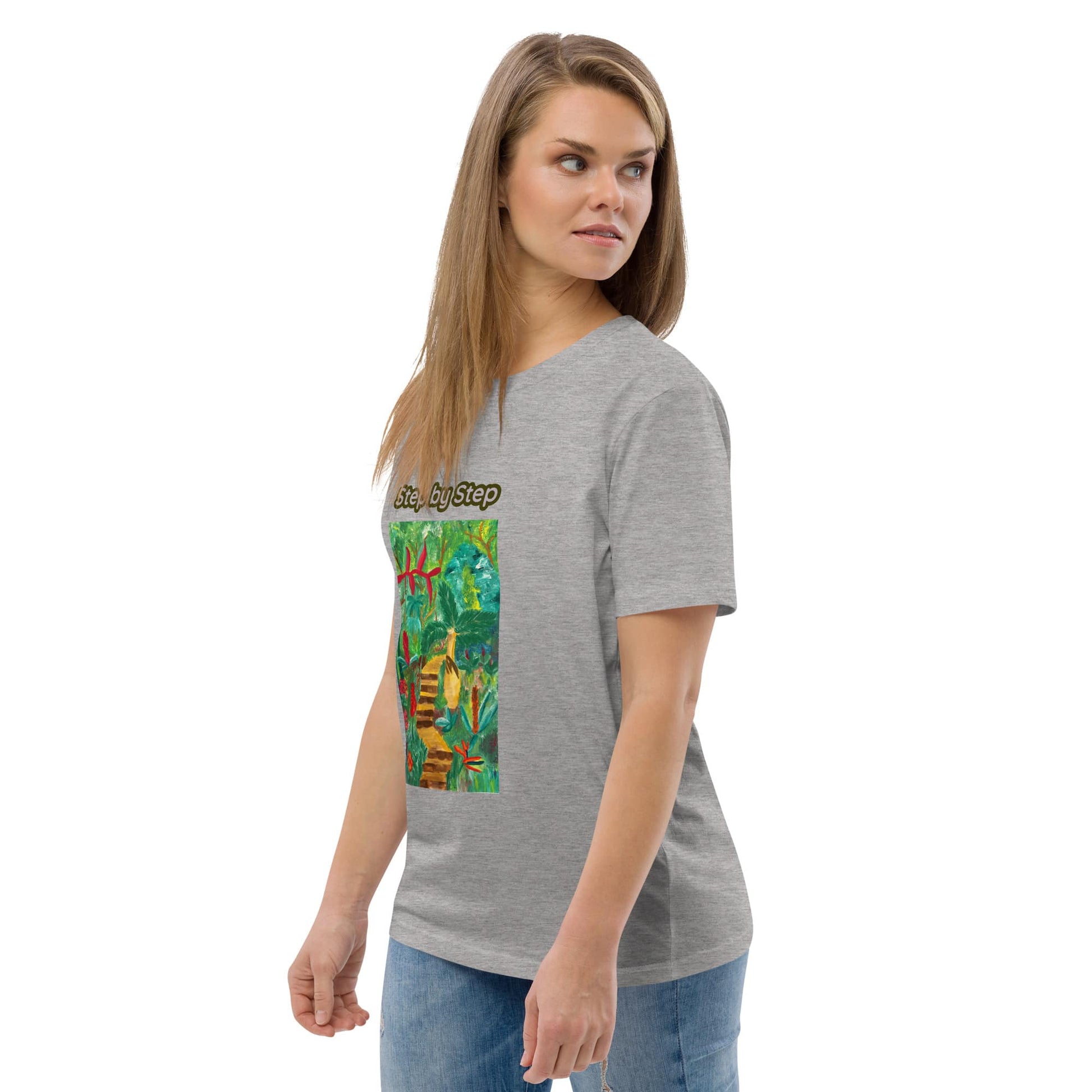 Woman wearing a gray t-shirt with a  artwork of greenery on a white background
